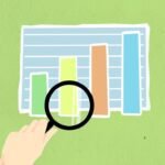 cutout paper appliques of hand with magnifier and chart